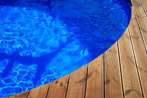 wood deck and round swimming pool